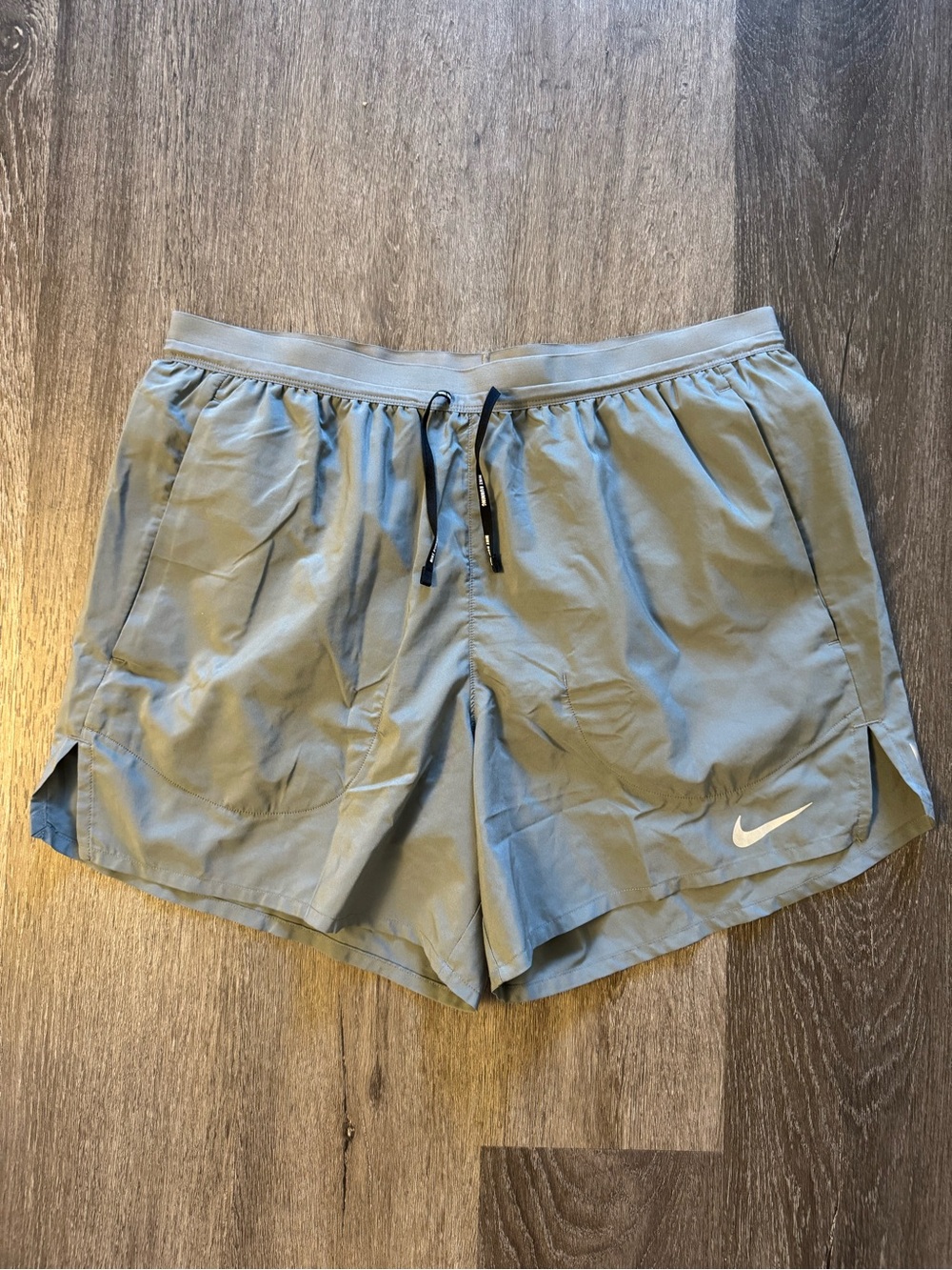 Nike Grey Running Shorts with White Swoosh Men’s Medium Loose Fit